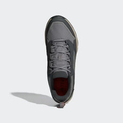 Gray athletic shoe on a light gray background
