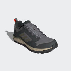Gray and black Adidas hiking shoe on a light gray background