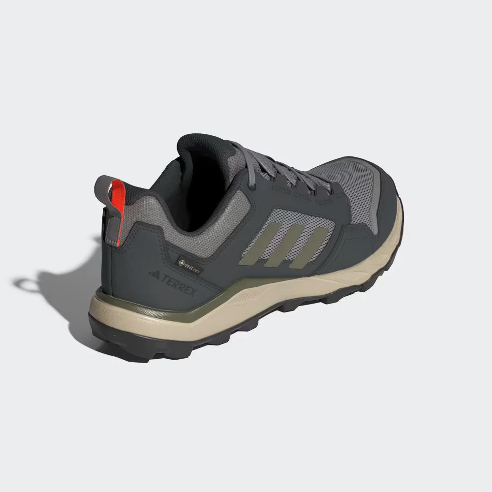 Gray hiking shoe with red accents on a light gray background