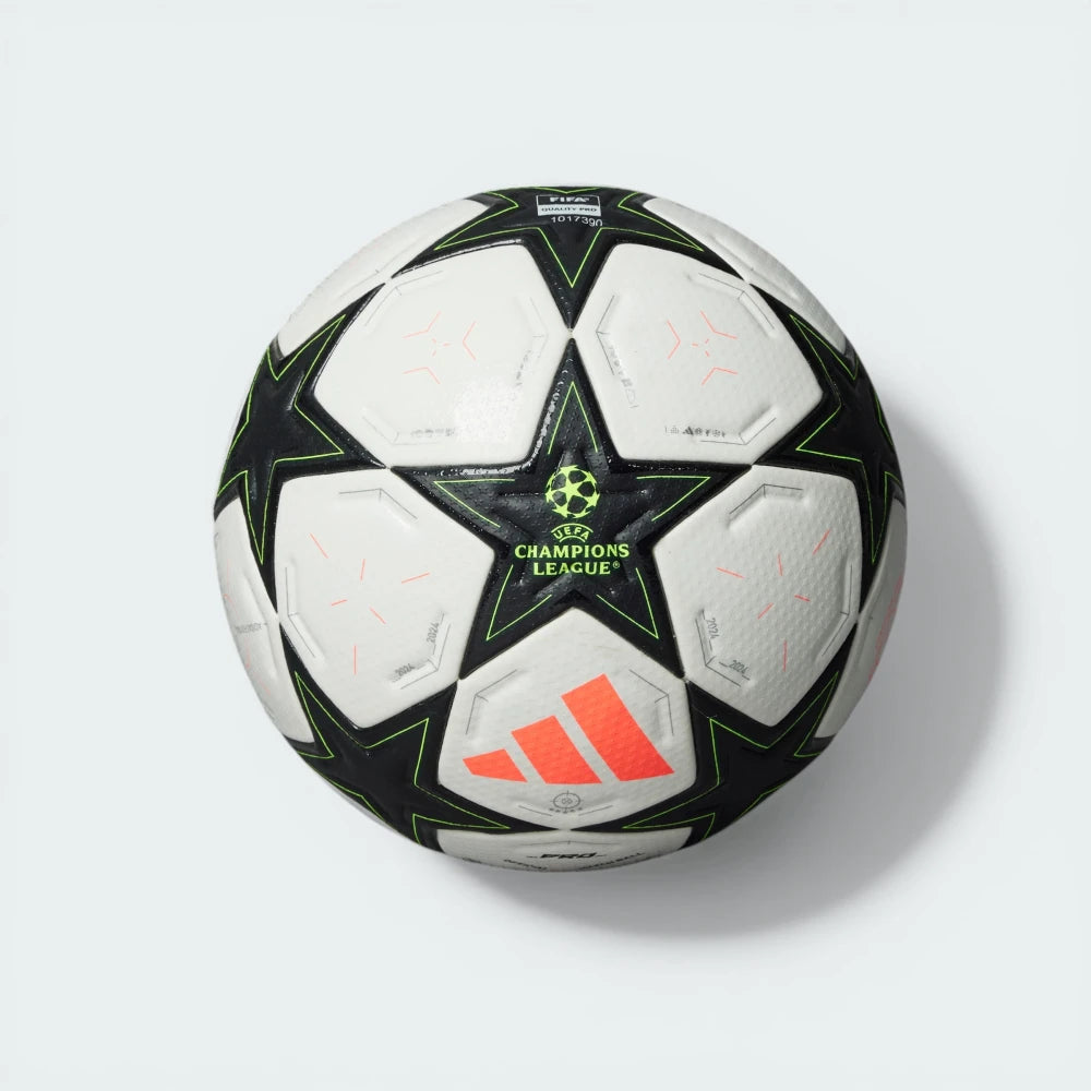Top-down view of the ball, showcasing the seamless construction and the vibrant Team Solar Yellow details.