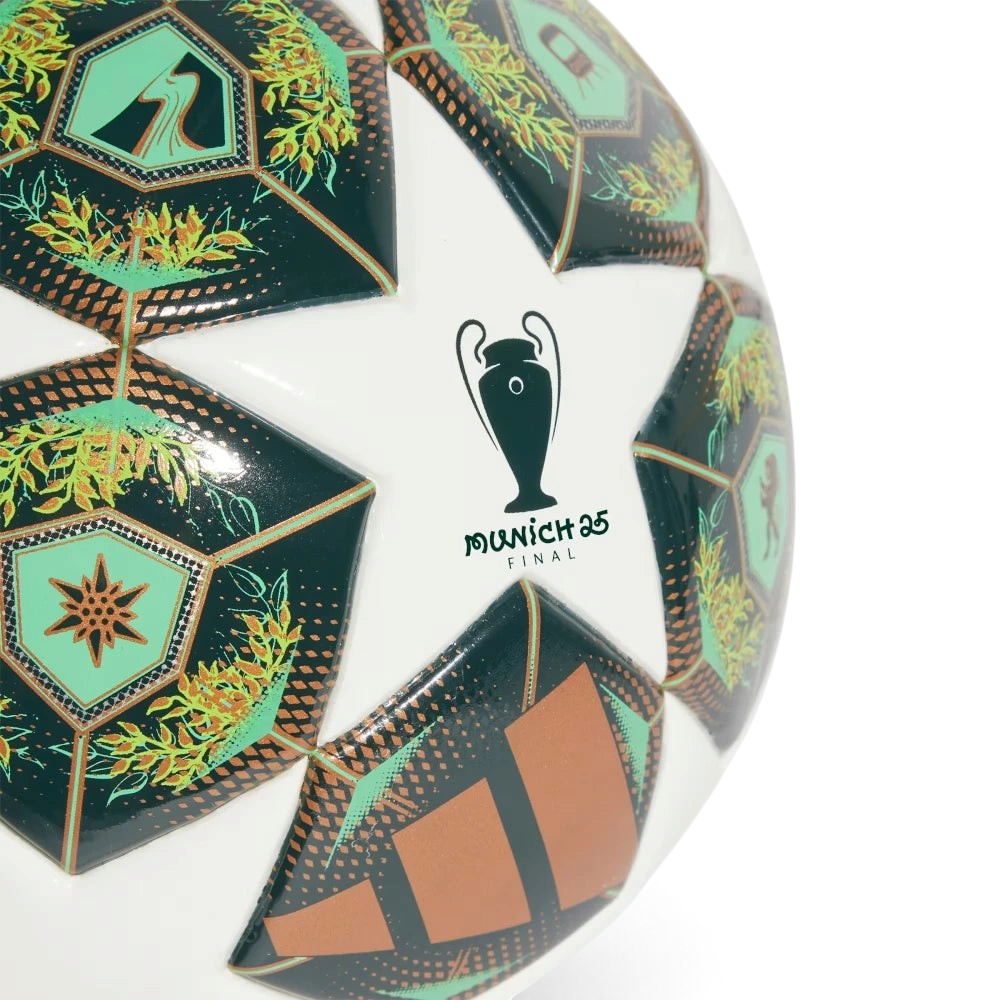 Highlights a close-up section focusing on the tournament trophy emblem, displaying the sharp "MUNICH 25 FINAL" text script set against a pristine white backdrop, surrounded by detailed green architectural and foliage panel prints.