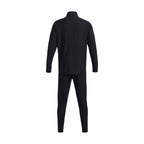 Highlights the clean rear profile of the matching black tracksuit, showcasing the seamless upper back panel across the shoulders, stand-up collar, and tapered trouser legs.