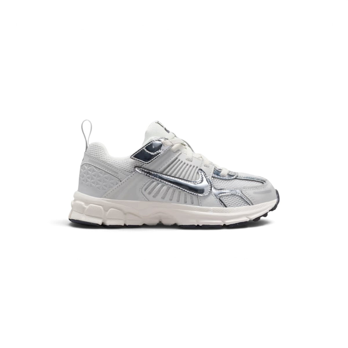 Studio lateral shot of the Nike Vomero 5 little kids' shoes in Photon Dust, Gridiron, Sail, and Chrome, highlighting the layered mesh upper, metallic chrome swoosh and overlays, supportive side caging, and cushioned foam sole. Main image