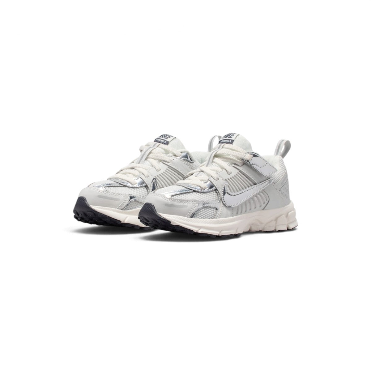 Front three-quarter perspective capturing the rounded toe box, metallic chrome overlays, and breathable forefoot mesh.
