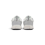 Rear-facing perspective focusing on the geometric molded heel counters, vertical pull tabs, and curved base of the foam midsole.