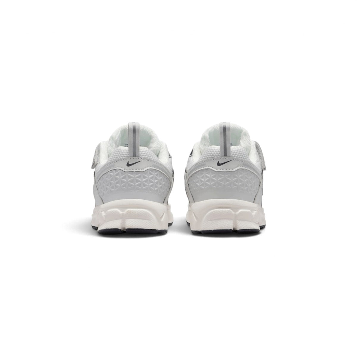 Rear-facing perspective focusing on the geometric molded heel counters, vertical pull tabs, and curved base of the foam midsole.
