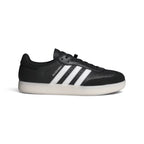Side Profile Image: Studio lateral shot of the adidas Velosamba Leather Shoes in Core Black and Cloud White, highlighting the black leather upper, white serrated three stripes, gold foil VELOSAMBA branding, and the clean white-grey sole.   