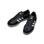 Top-Down View of Pair: Overhead view looking down at the laced black commuter shoes, showcasing the black flat laces, lace bungee retainer, and the clean interior lining.   