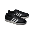 Angle View Showing Details Side by Side: Angled front-three-quarter perspective capturing the reinforced suede T-toe overlay, perforated toe box detailing, and contrast side striping.   