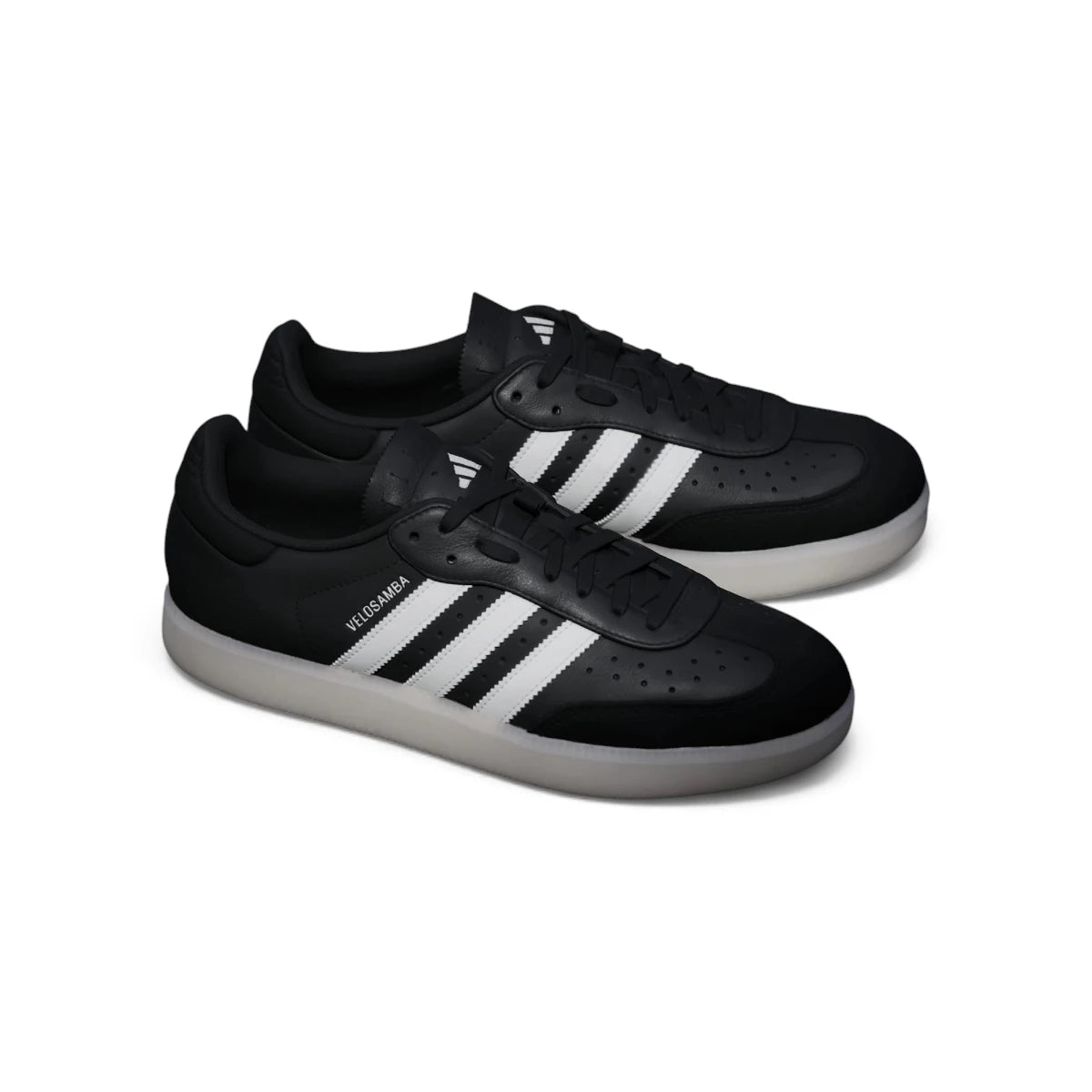 Angle View Showing Details Side by Side: Angled front-three-quarter perspective capturing the reinforced suede T-toe overlay, perforated toe box detailing, and contrast side striping.   