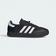 Highlights the high-velocity sweep of the reflective Cloud White 3-Stripes, showing the crisp canvas weave of the Core Black textile upper and the sleek integration of the low-profile cycling sole.