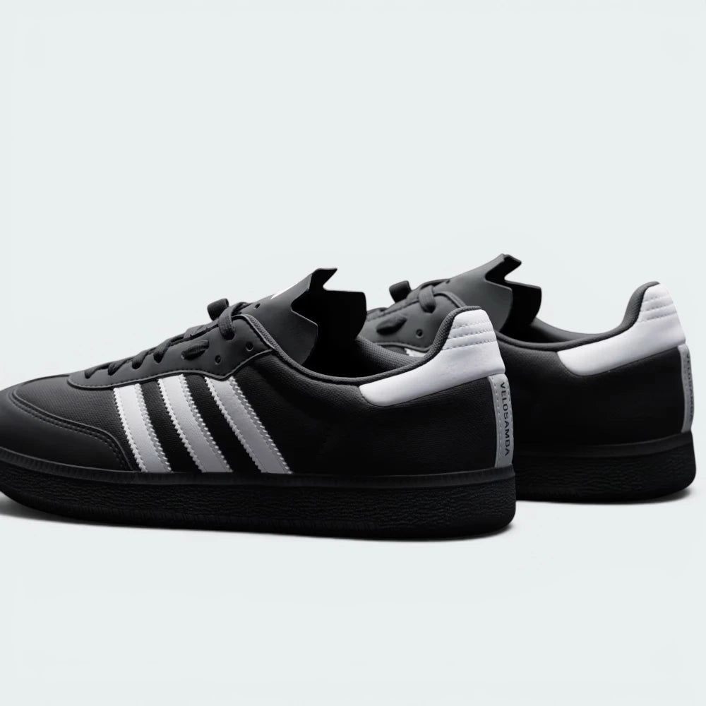 Focuses on the contoured shape of the black heel tab and the clean finish of the low-profile rubberized sole casing.