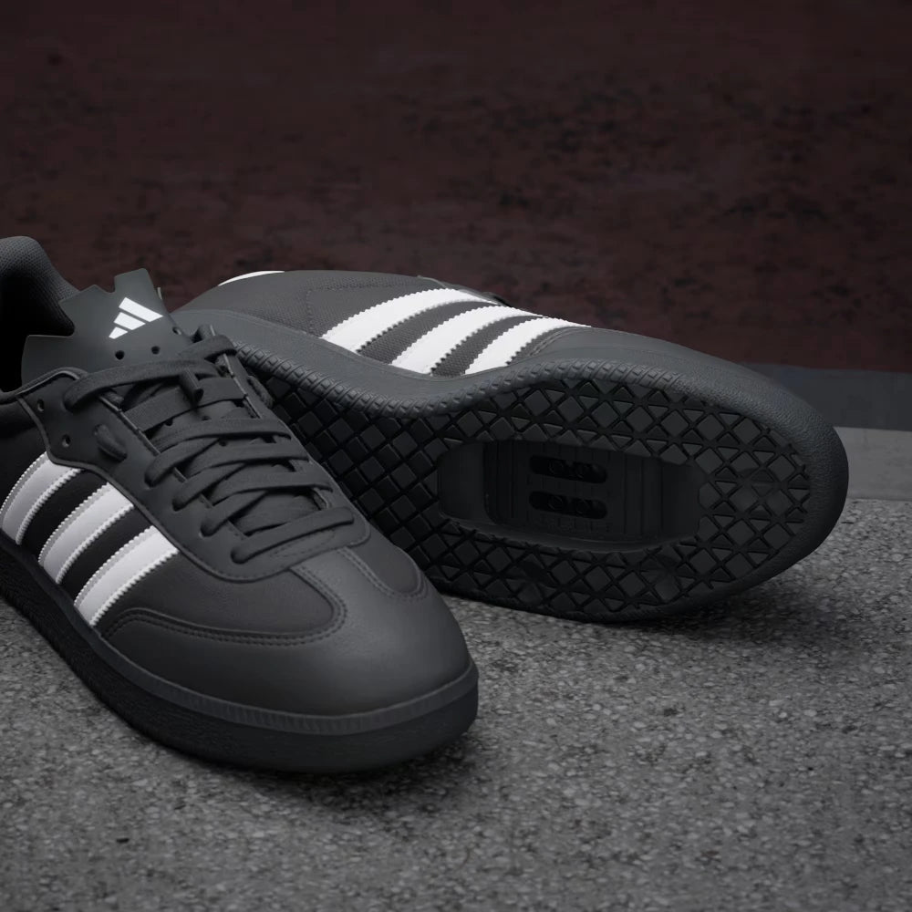 Details the premium dual-stitching lines tracing the iconic T-toe reinforcement textile panels and the precision layout of the lace eyes.