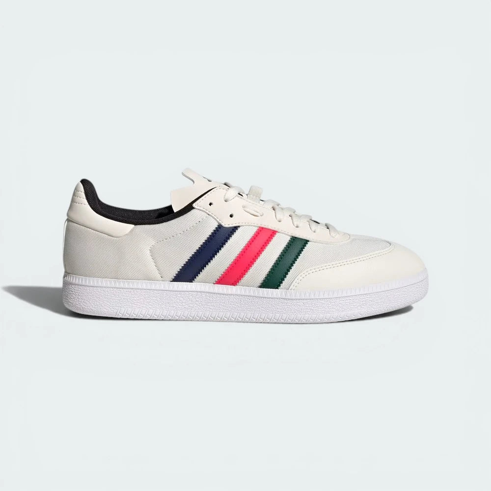 White sneaker with colorful stripes on a light gray background