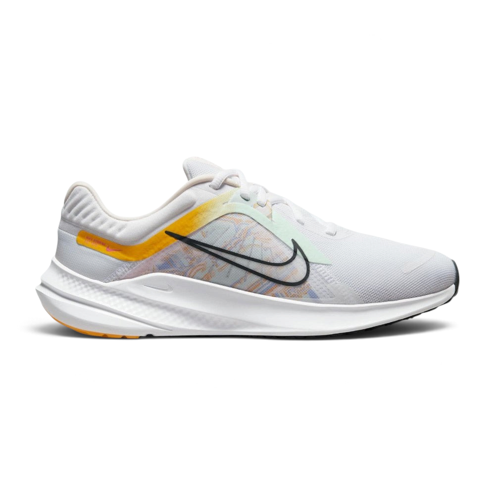 Highlights the high-velocity sweep of the University Gold Nike Swoosh, showing the clean texture of the white mesh upper, the subtle pale pink midsole accenting, and the sleek dark smoke grey rubber outsole line. Main image