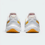 Focuses on the contoured shape of the padded low-cut collar, highlighting the wide, stable footprint of the heel and the clean rear branding details.