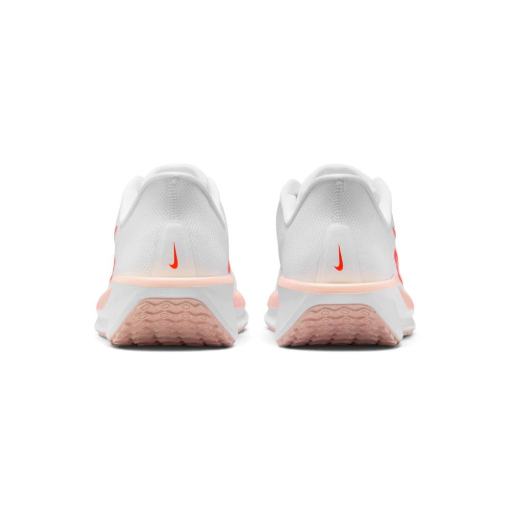 Focuses on the rear profile, highlighting the structured white mesh heel counters with vertical Bright Crimson micro-Swoosh accents, Washed Coral upper rim, and the wide footprint of the white foam midsole base.