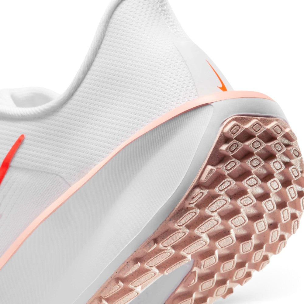 Highlights the "unreal" clean finish where the thick white foam midsole meets the Washed Coral rubber outsole tread, displaying the textured tread lugs and rear heel cup trim.