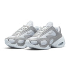 Emphasising the sculpted three-quarter stance of the shoes and the striking contrast between the smooth metallic silver overlays and breathable mesh underlays.