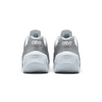 Focuses on the rear profile, highlighting the raised metallic silver heel counters stamped with white "aM" Air Max logos, and the wide flared footprint of the sculpted white foam heel base.