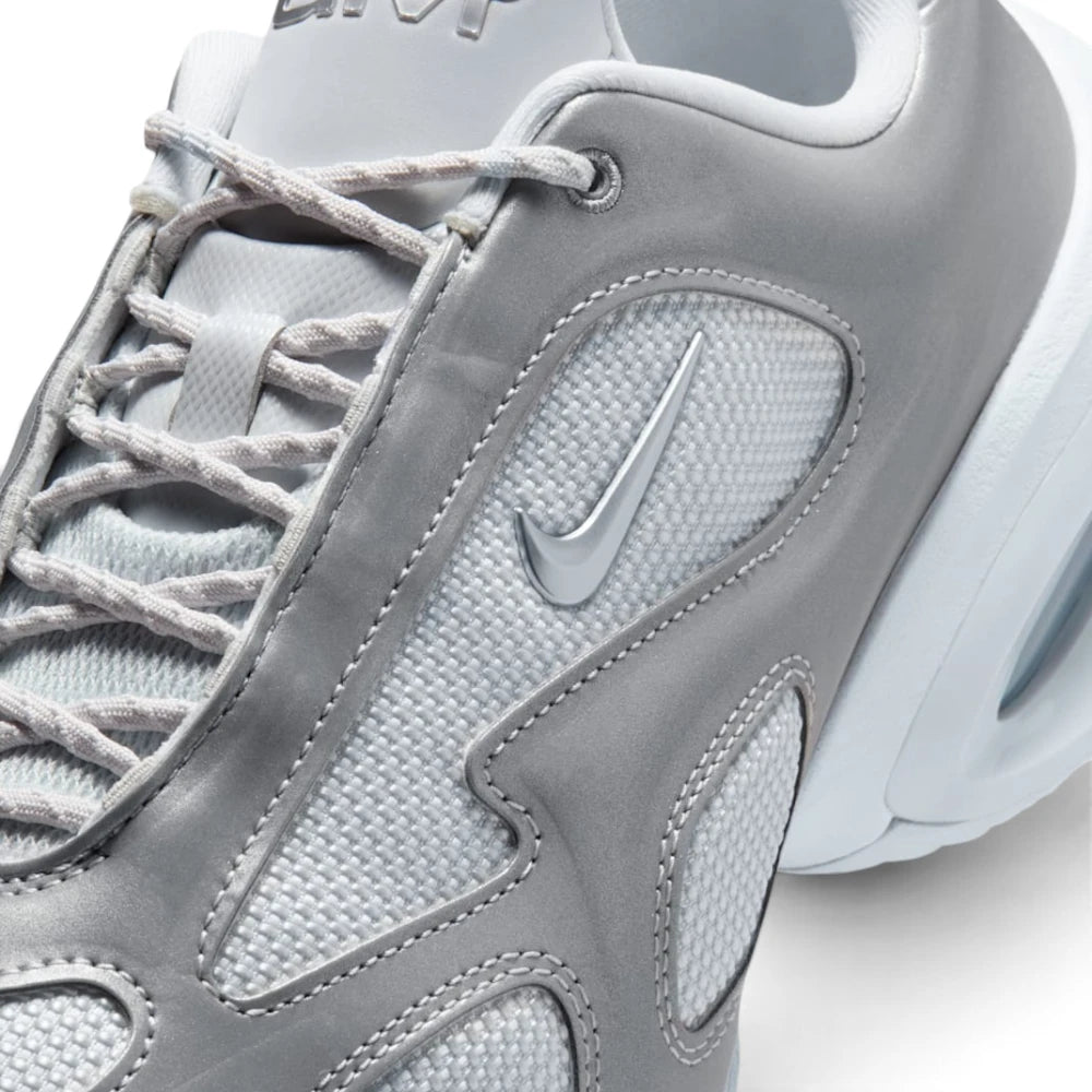 Details the micro-precision of the upper, showing the fine-gauge Pure Platinum mesh toe pod, double-stitched metallic silver synthetic overlays, flecked laces, and the raised metallic Swoosh.