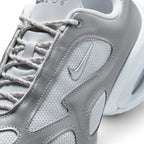 Details the micro-precision of the upper, showing the fine-gauge Pure Platinum mesh toe pod, double-stitched metallic silver synthetic overlays, flecked laces, and the raised metallic Swoosh.