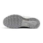 Full-length bottom profile showing the hard-wearing rubber outsole, displaying the heritage Waffle-inspired square traction lugs, multi-directional perimeter pods, deep forefoot flex grooves, and debossed central Nike Swoosh.