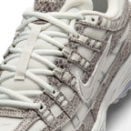 Breathable Off-White Mesh Forefoot, Textured Snakeskin-Print Suede Toe Guard, and Flat Lacing Matrix, demonstrating the tactile reptilian scale detail, scuff defence boundaries, and refined finish as the stylish final detail.