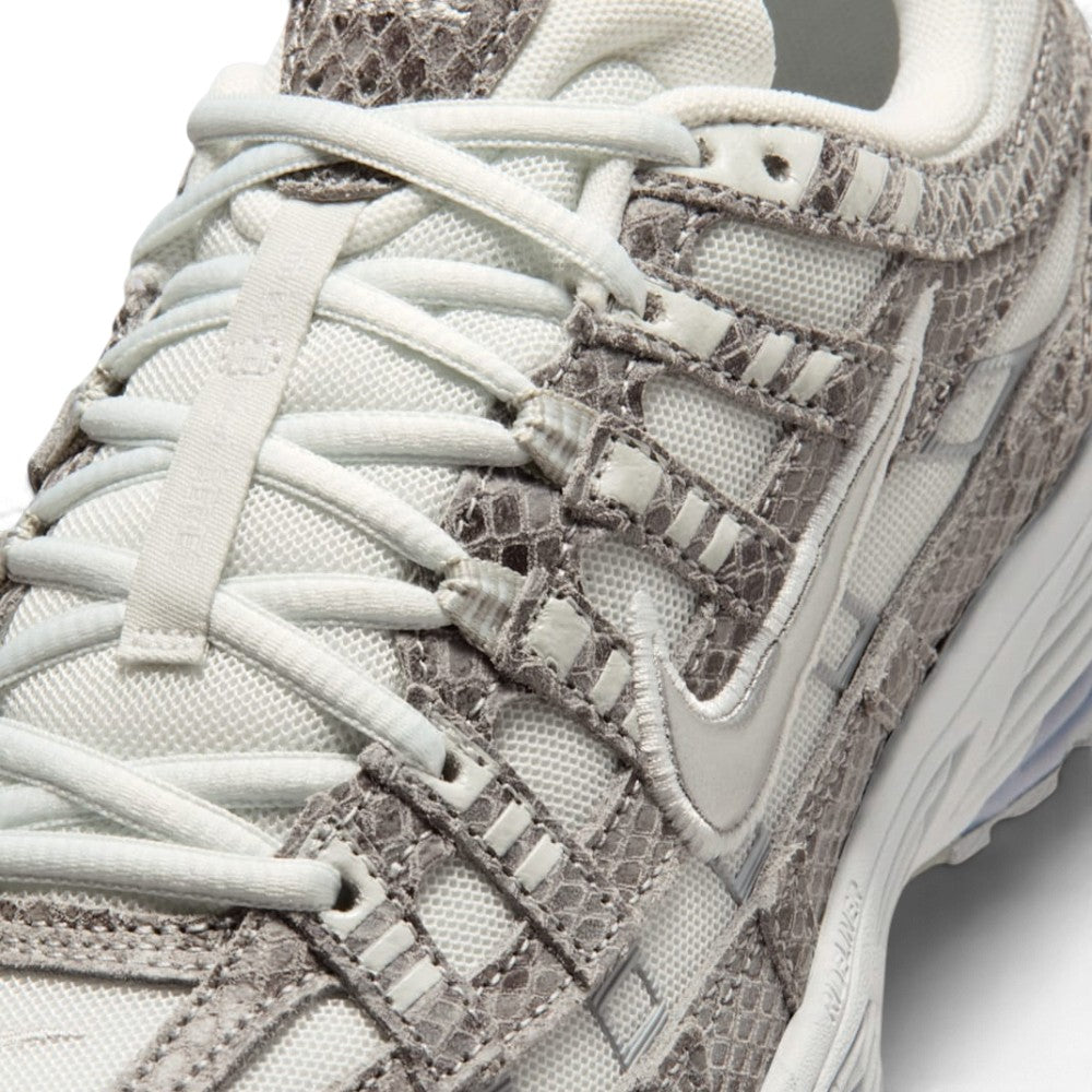 Breathable Off-White Mesh Forefoot, Textured Snakeskin-Print Suede Toe Guard, and Flat Lacing Matrix, demonstrating the tactile reptilian scale detail, scuff defence boundaries, and refined finish as the stylish final detail.