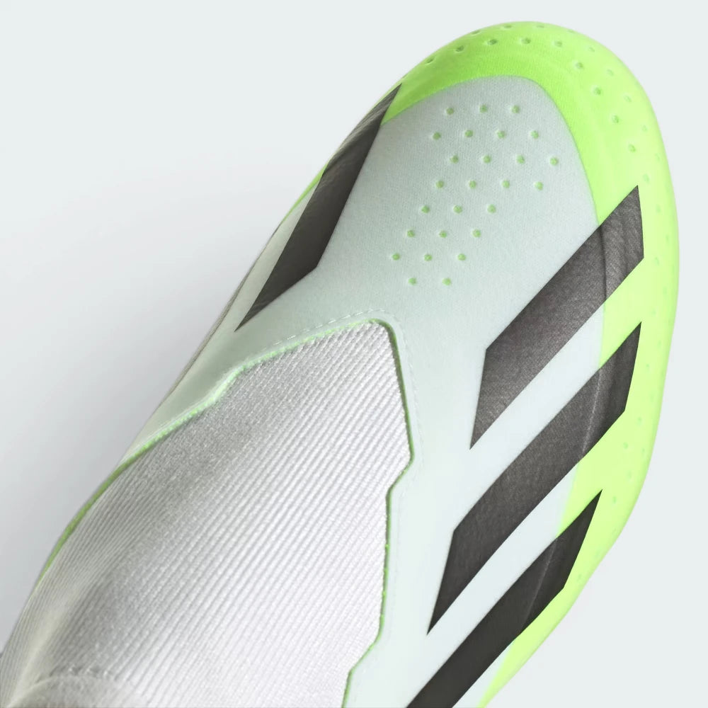 Details the high-definition micro-textures on the laceless strike zone and the clean finish of the toe box.