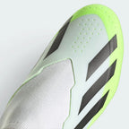 Details the high-definition micro-textures on the laceless strike zone and the clean finish of the toe box.