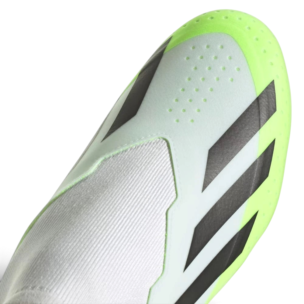 Details the high-definition micro-textures on the laceless strike zone and the clean finish of the toe box.
