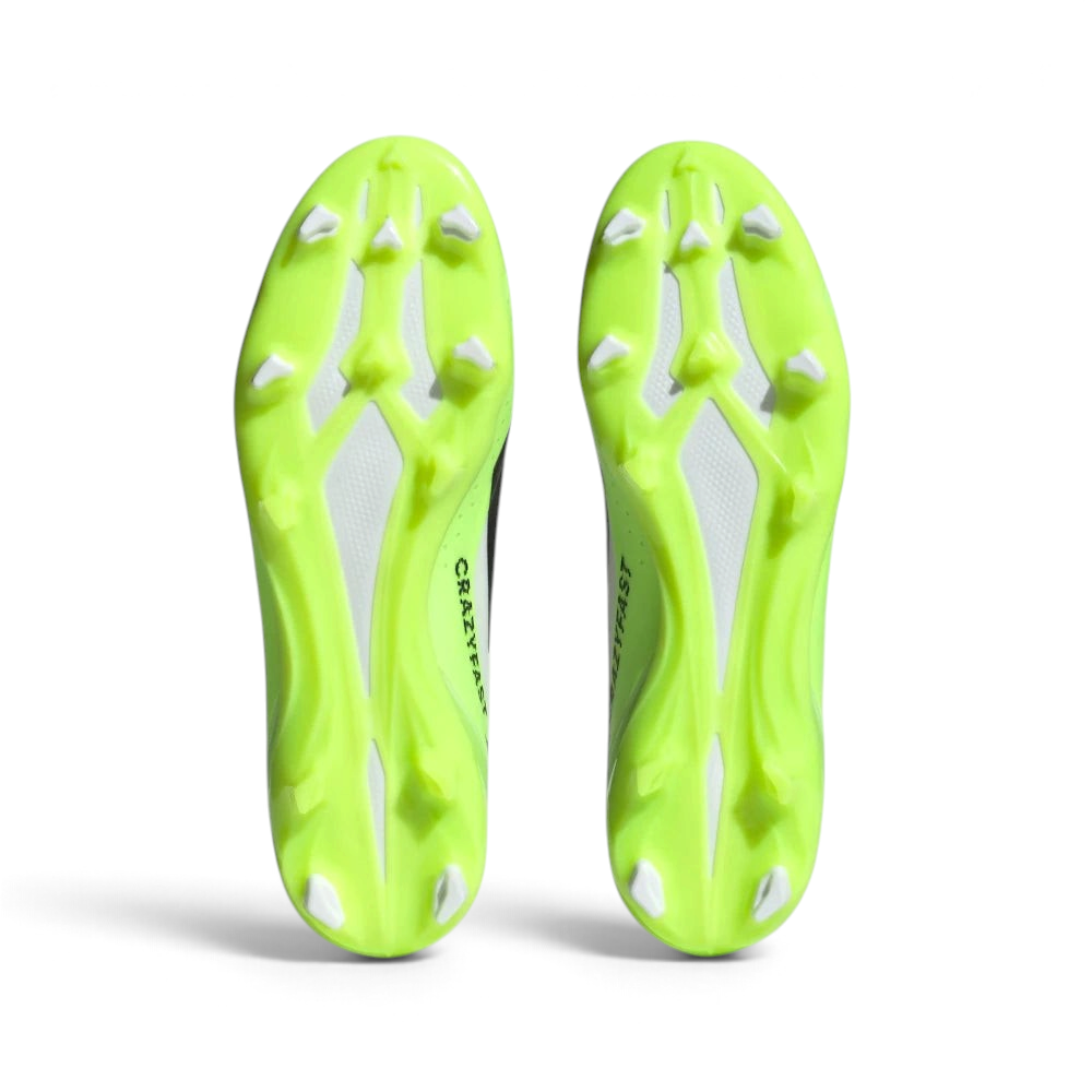 Displays the technical firm ground stud matrix engineered for unreal traction and multi-directional propulsion on dry grass.