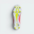 Displays the technical firm ground outsole stud matrix designed for unreal traction and rapid acceleration on dry grass.