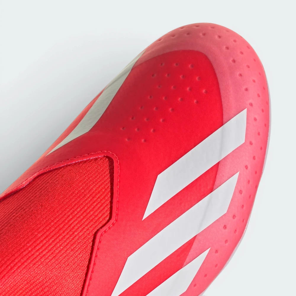 Details the high-definition micro-textures on the laceless strike zone and the clean finish of the toe box.