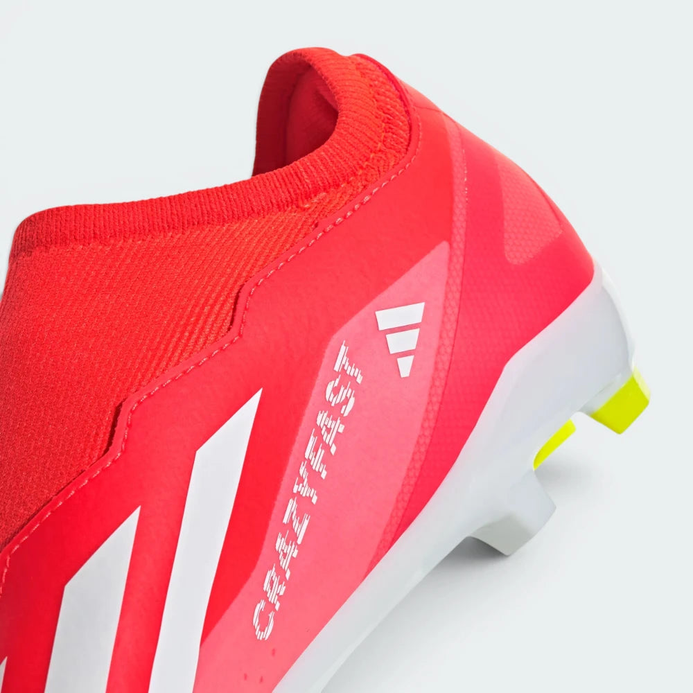 Red sports shoe with white accents on a light gray background