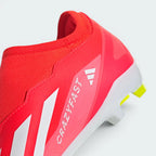 Red sports shoe with white accents on a light gray background