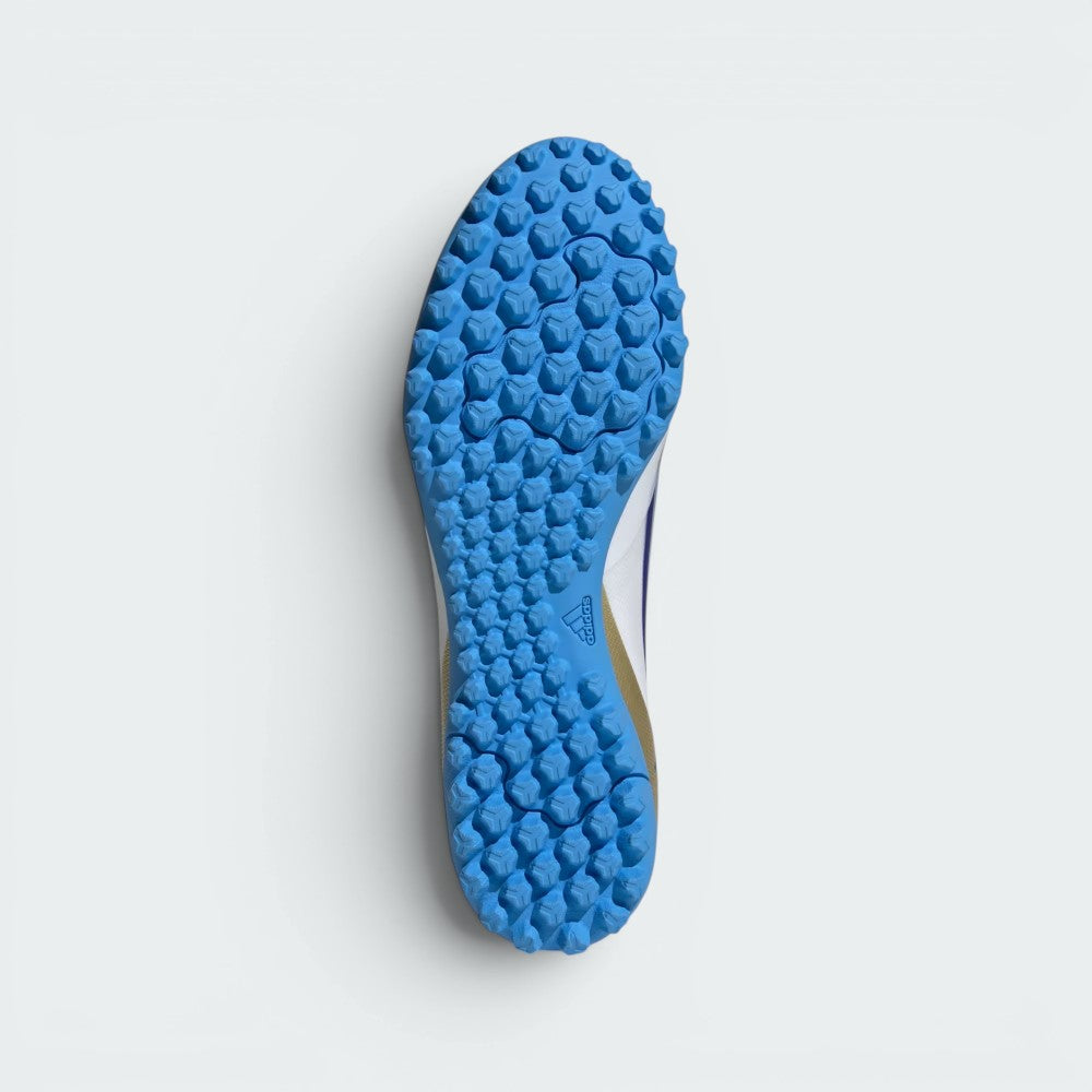 Displays the technical lug rubber outsole layout engineered for unreal multi-directional traction on artificial turf.