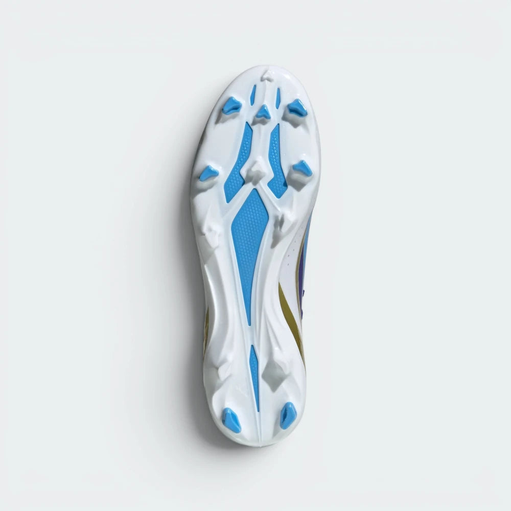 Displays the technical firm ground outsole stud matrix designed for unreal grip and multi-directional propulsion on dry grass.