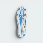 Displays the technical firm ground outsole stud matrix designed for unreal grip and multi-directional propulsion on dry grass.