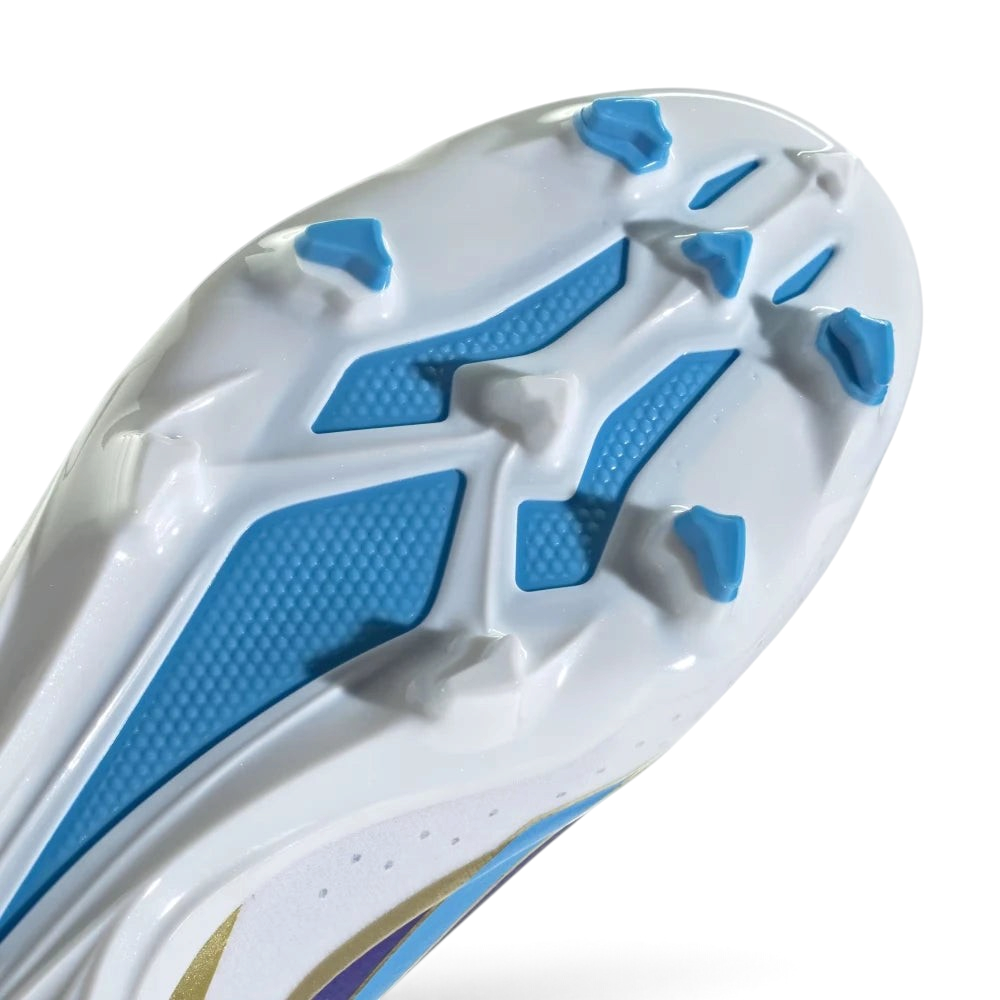 Close-up of a shoe sole with blue and white pattern on a light gray background