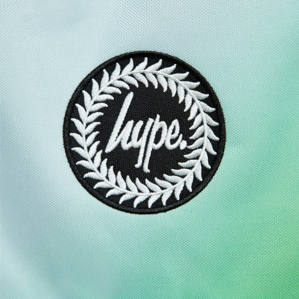 Details the high-definition embroidery and the precision of the front pocket zip.