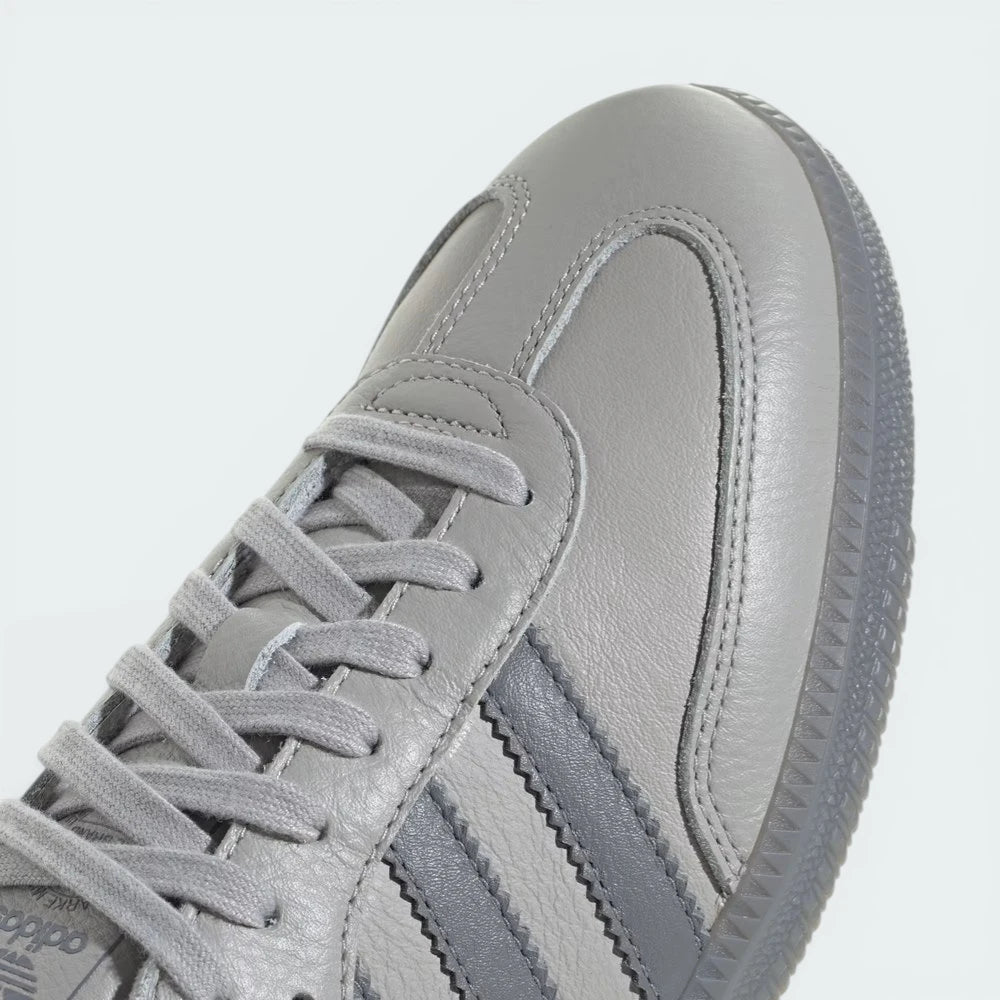 Detailed zoom on the tongue and the Adidas Trefoil branding, showcasing the heritage "Grey Two" details.
