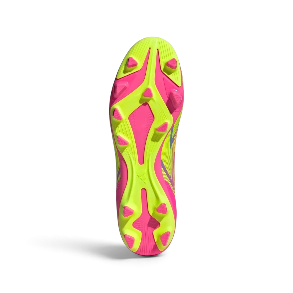 Displays the multi-pitch stud configuration of the firm/multi-terrain sole, showcasing the hybrid molded studs engineered for unreal grip on both natural grass and artificial turf.