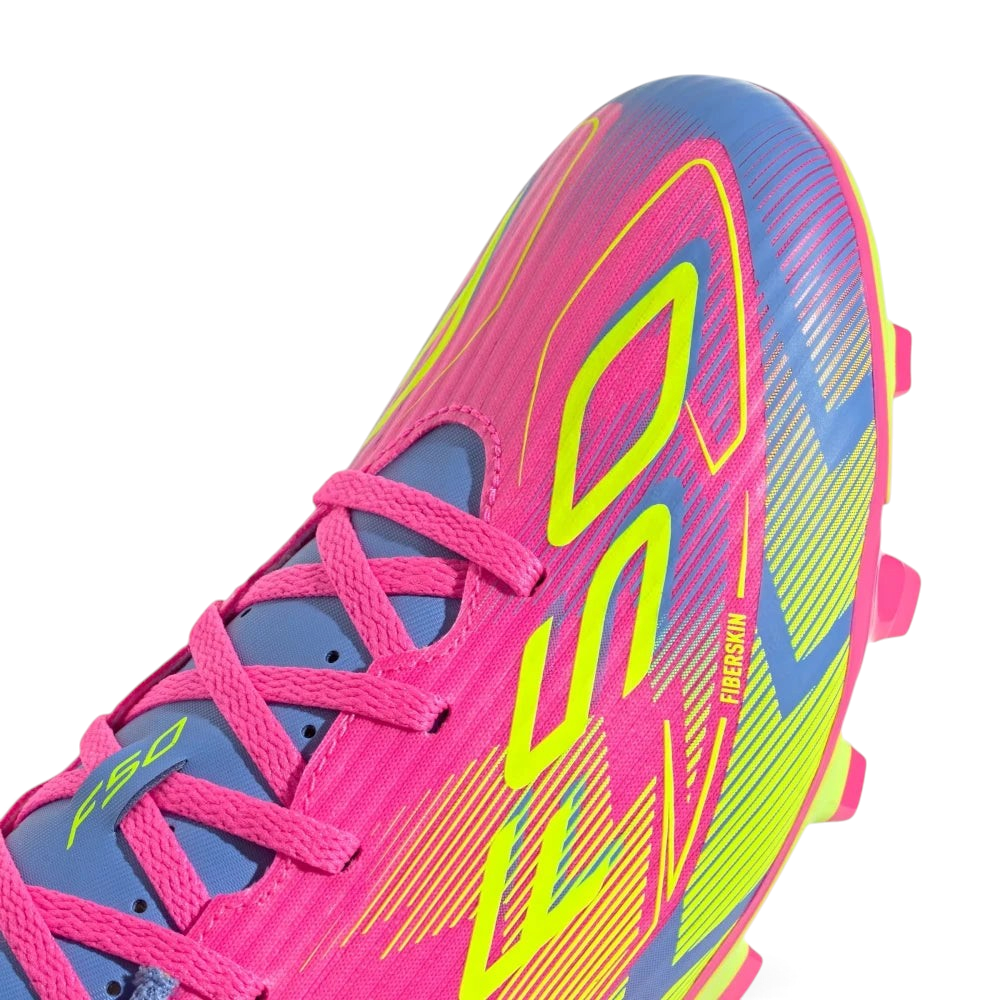 Details the micro-textured Fiberskin pattern wrapping the front toe cap to optimize ball touch, alongside the neat lace tracking.