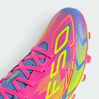 Details the micro-textured Fiberskin pattern wrapping the front toe cap to optimize ball touch, alongside the neat lace tracking.