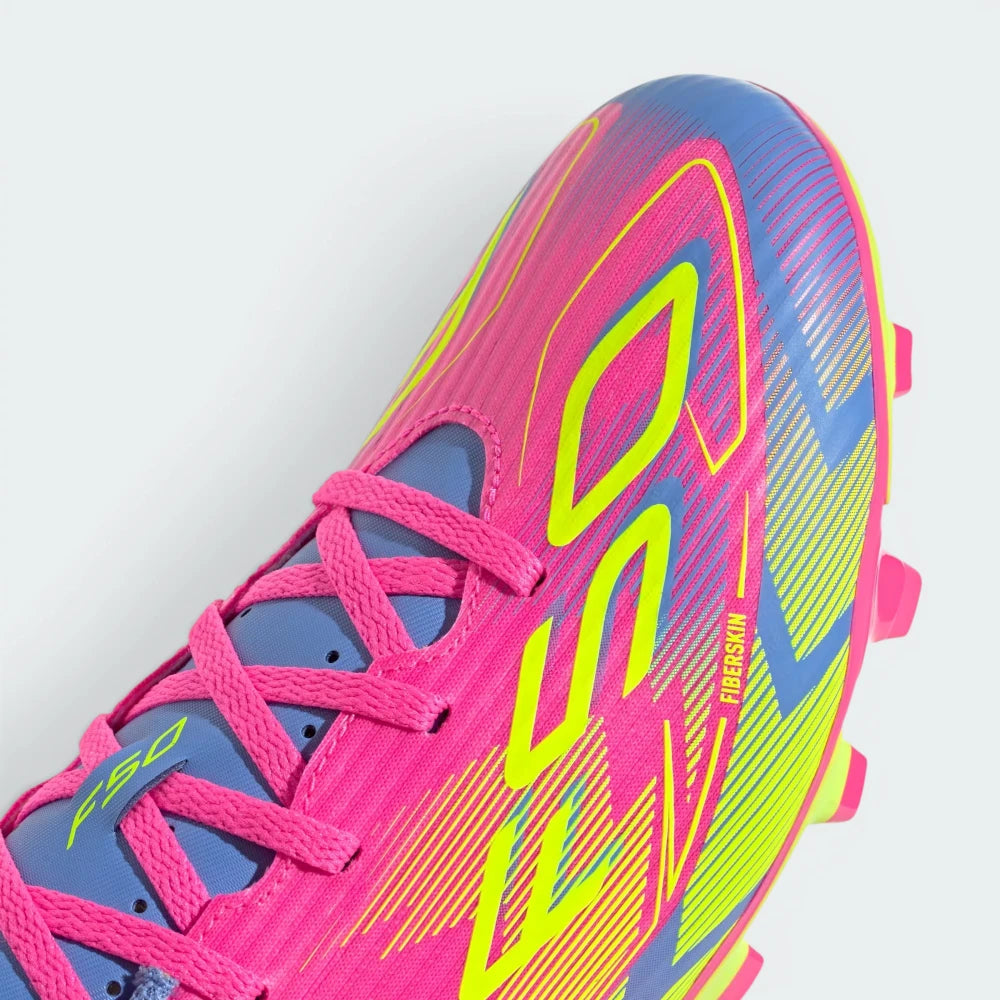 Details the micro-textured Fiberskin pattern wrapping the front toe cap to optimize ball touch, alongside the neat lace tracking.