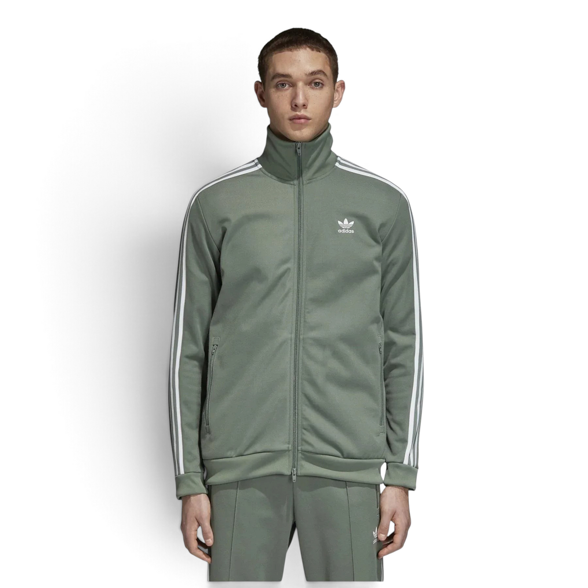 Person wearing a green Adidas tracksuit on a white background Main image