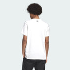A white Adidas Samstag graphic tee logo on the back of the neck