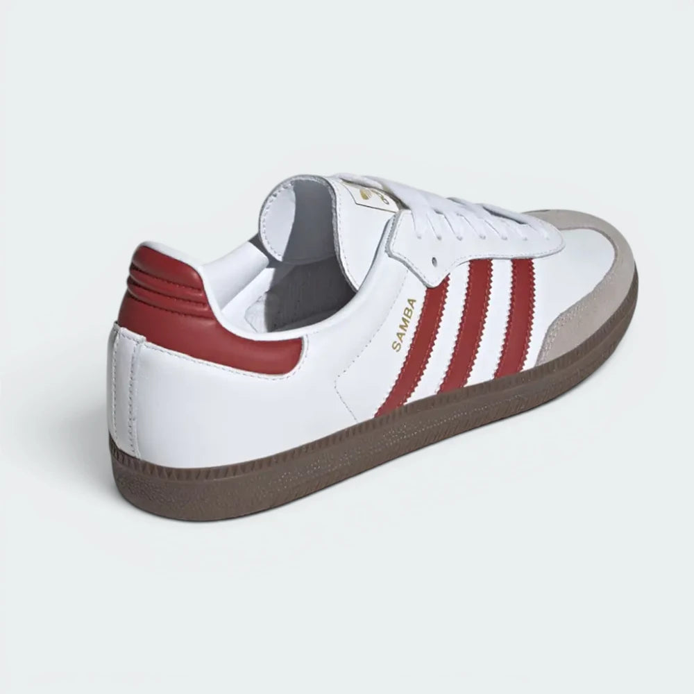 Focuses on the contoured shape of the Preloved Ruby leather heel tab and the clean finish of the gum rubber sole stitching.
